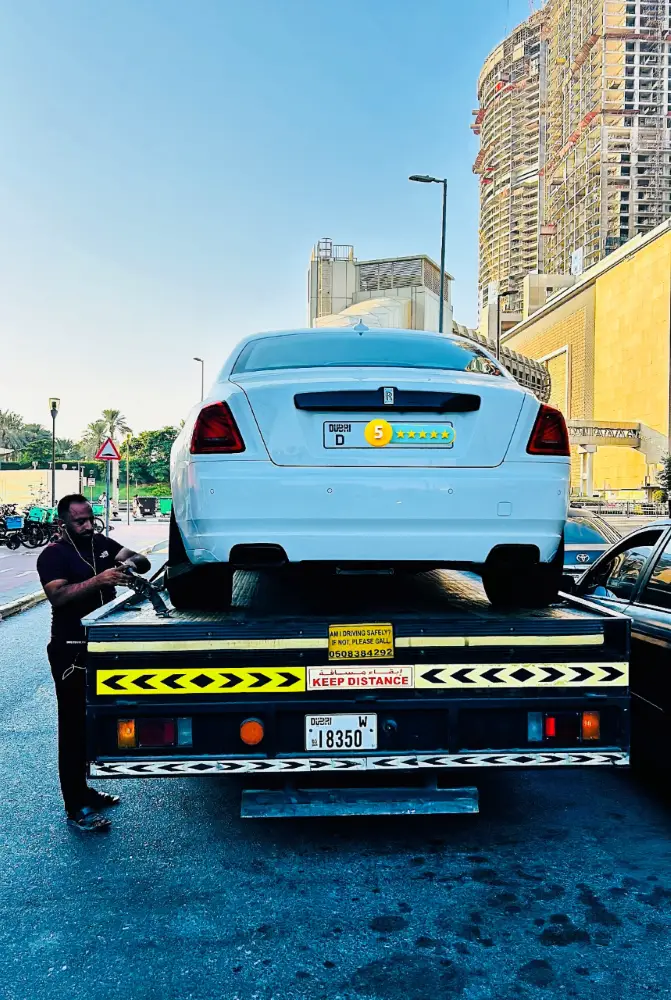 Professional car repair technician working at Car Aid Dubai